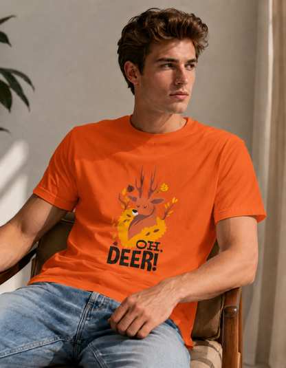 Man wearing an orange t-shirt with a deer graphic and 'OH DEER!' text, sitting in a chair.