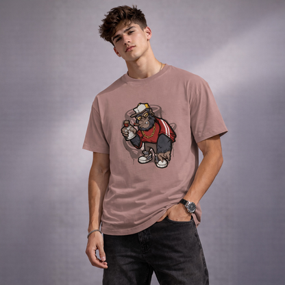 Person wearing a pink t-shirt with a graphic design of a monkey wearing a hat and jacket on a gray background