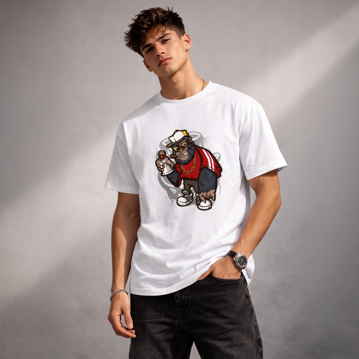 Man wearing a white t-shirt with a graphic design of a gorilla holding a megaphone on a gray background