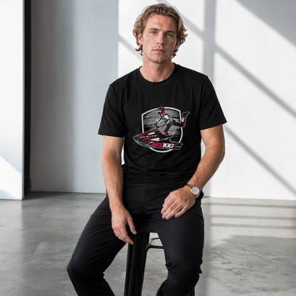 Man wearing a black t-shirt with a graphic design sitting on a stool.
