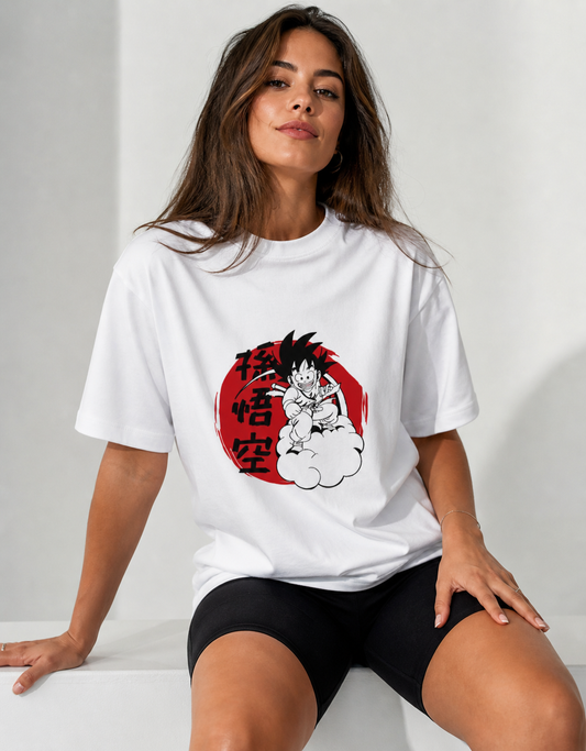 Woman wearing a white t-shirt with a graphic design on a plain background