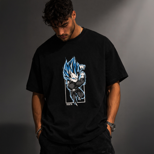 Person wearing a black t-shirt with a graphic design on a gray background