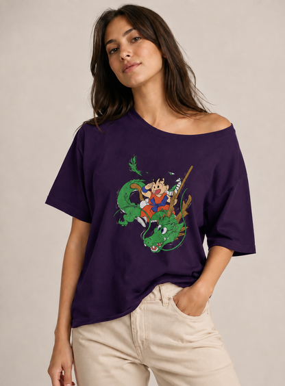 Woman wearing a purple t-shirt with a dragon and character design on a beige background